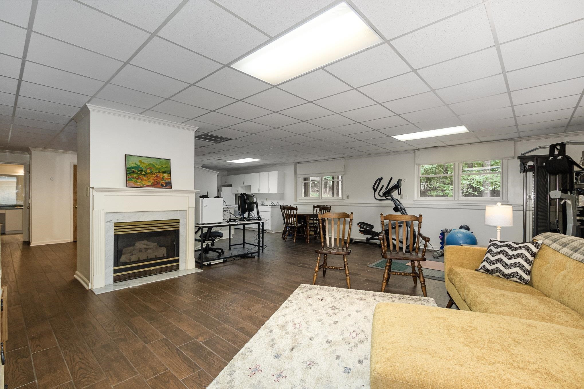 3200 Twin Streams Road Chapel Hill, NC 27516 - Photo 25 of 46 a living room with furniture a fireplace and wooden floor