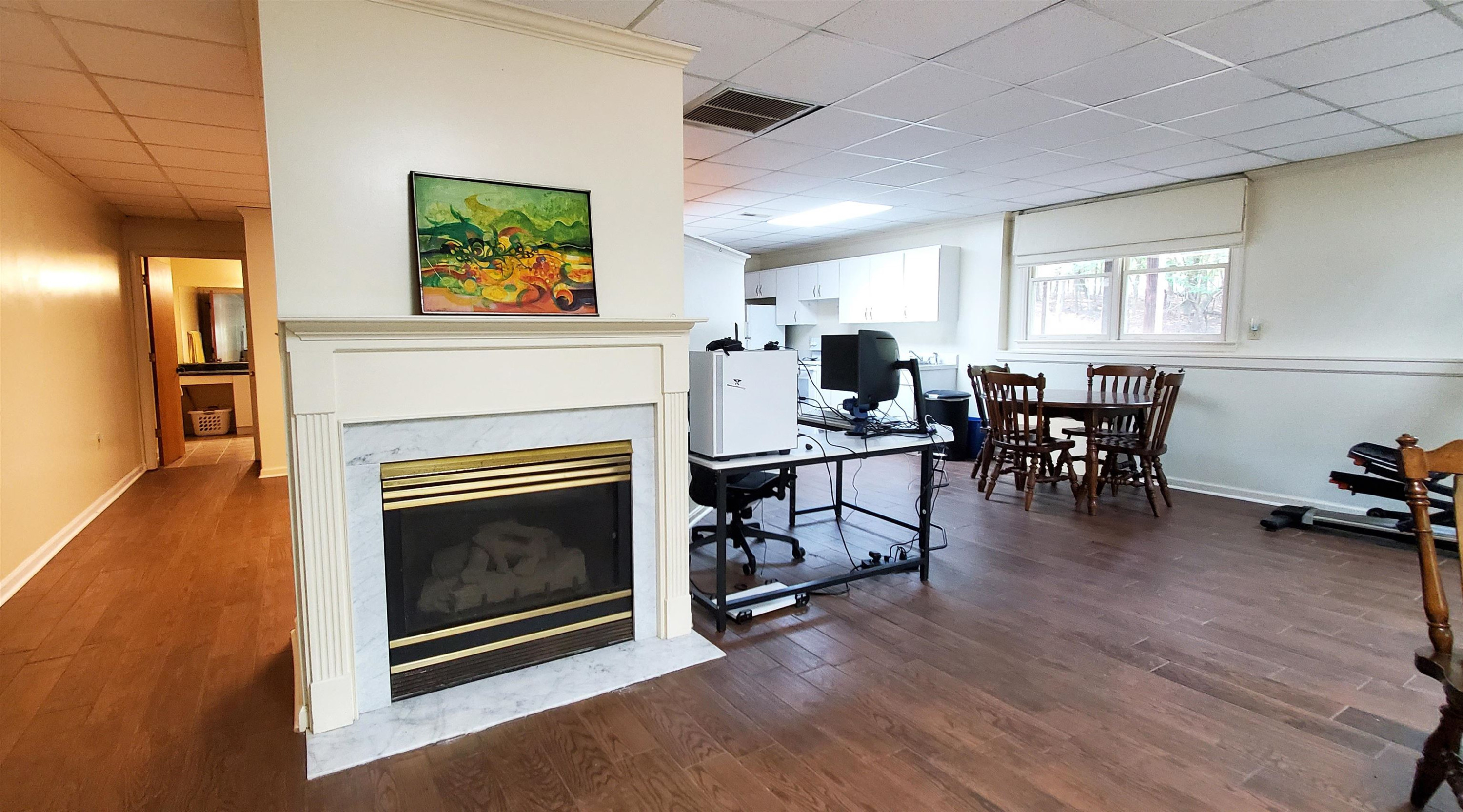 3200 Twin Streams Road Chapel Hill, NC 27516 - Photo 27 of 46 a living room with furniture a fireplace and wooden floor