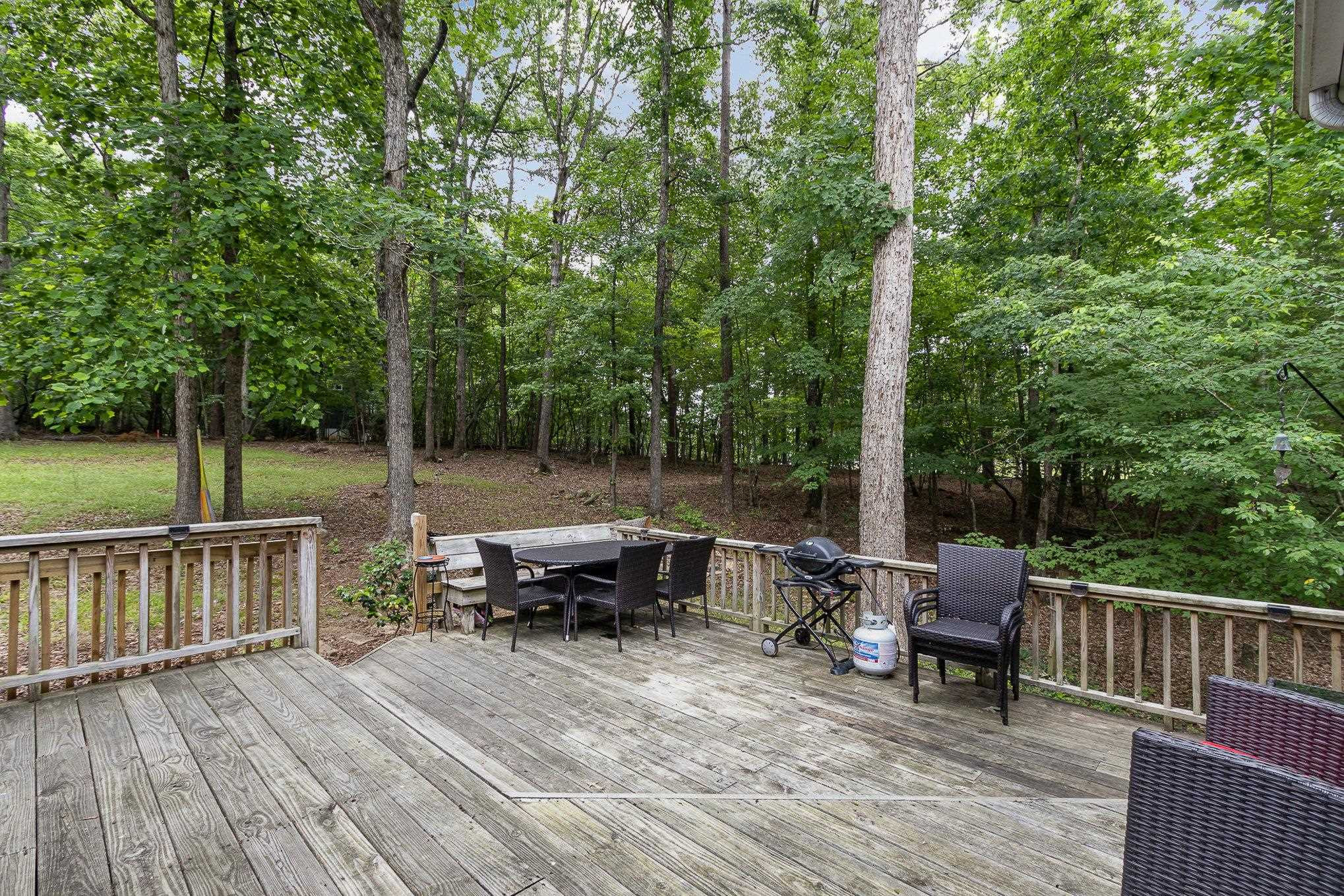 3200 Twin Streams Road Chapel Hill, NC 27516 - Photo 33 of 46 a view of a wooden deck with chairs