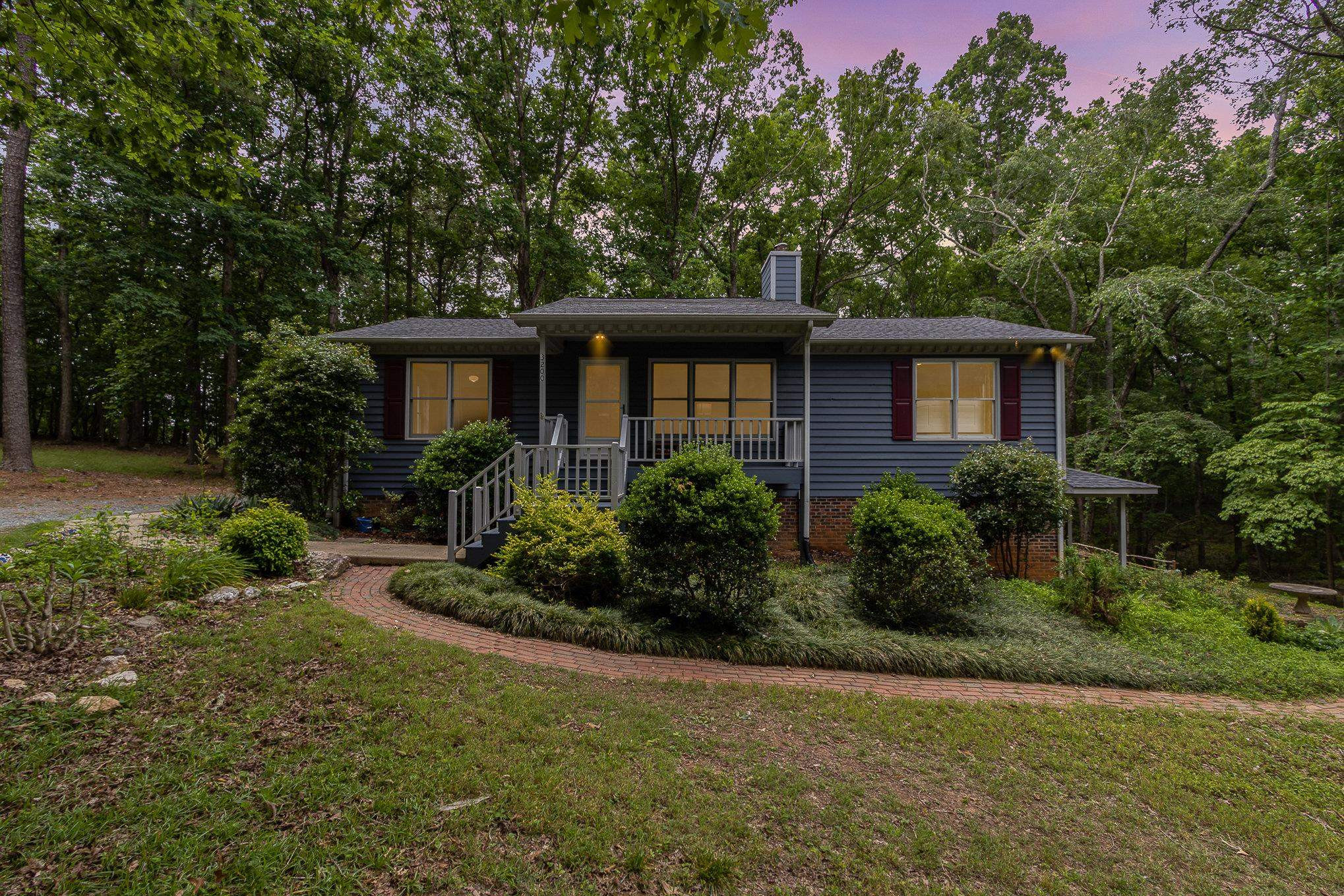 3200 Twin Streams Road Chapel Hill, NC 27516 - Photo 46 of 46 a front view of a house with garden