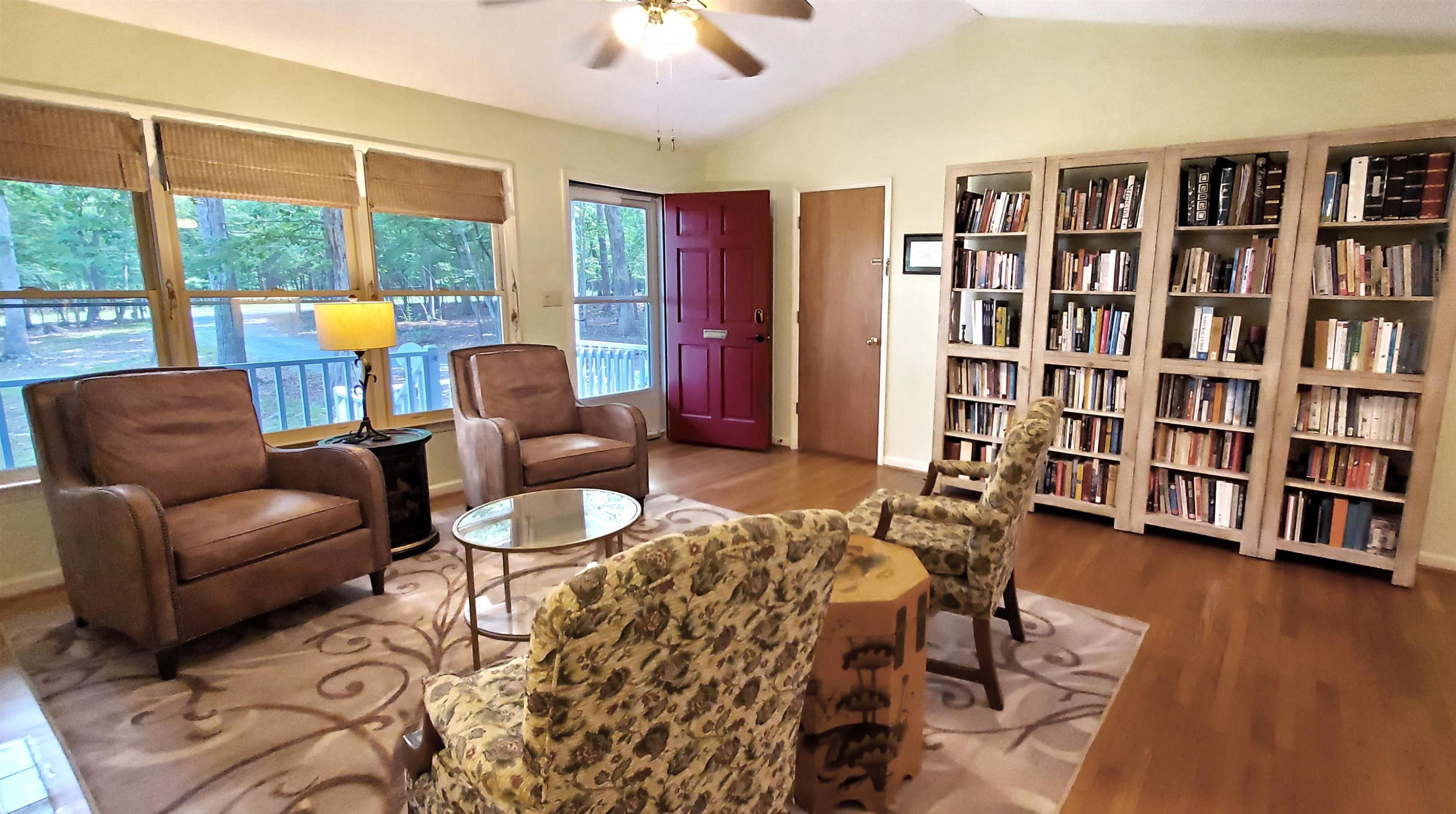 3200 Twin Streams Road Chapel Hill, NC 27516 - Photo 6 of 46 a living room with furniture and a book shelf