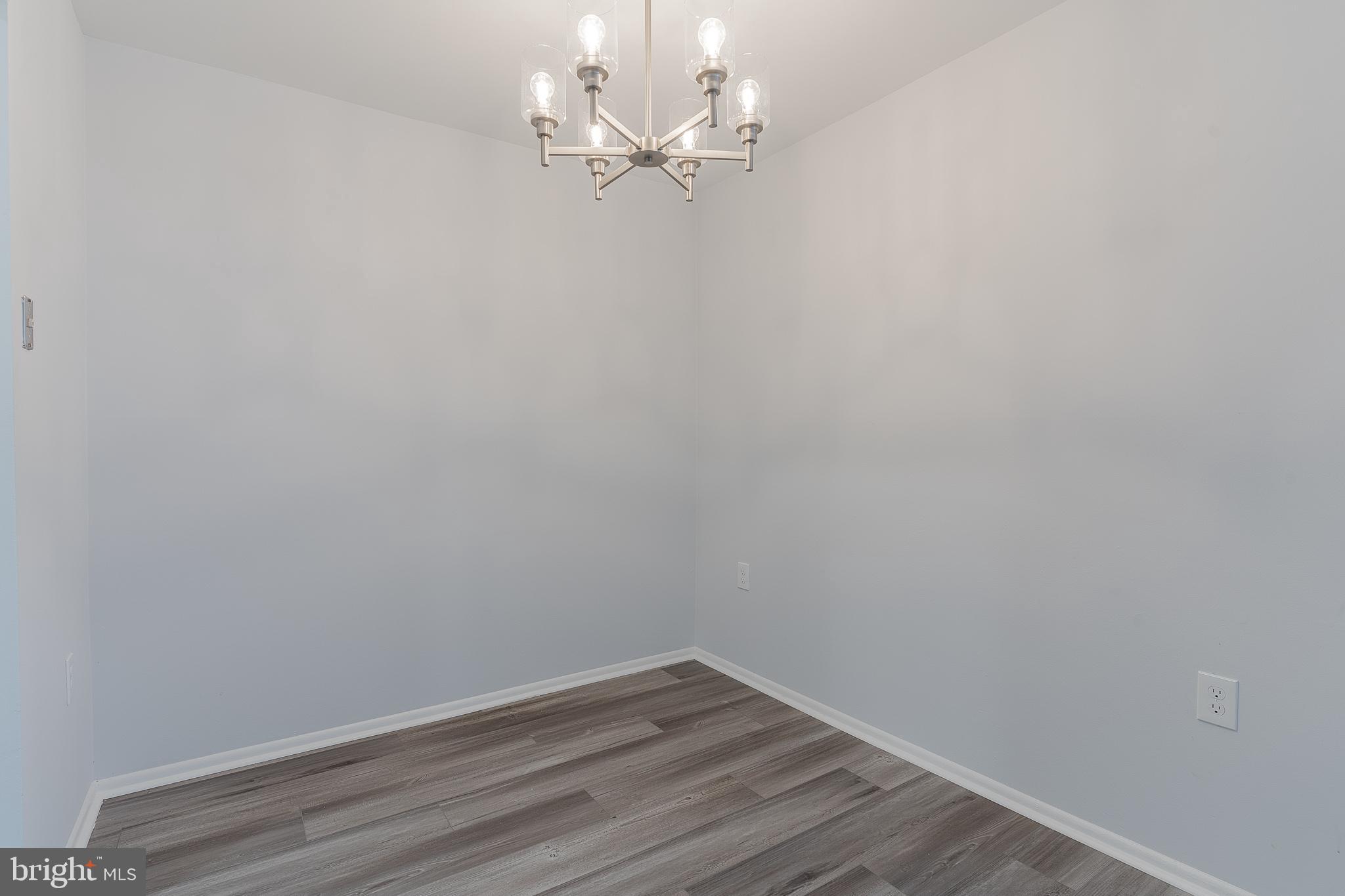 8708 Village Square Drive Alexandria, VA 22309 - Photo 11 of 46 a view of a room with wooden floor and a fan