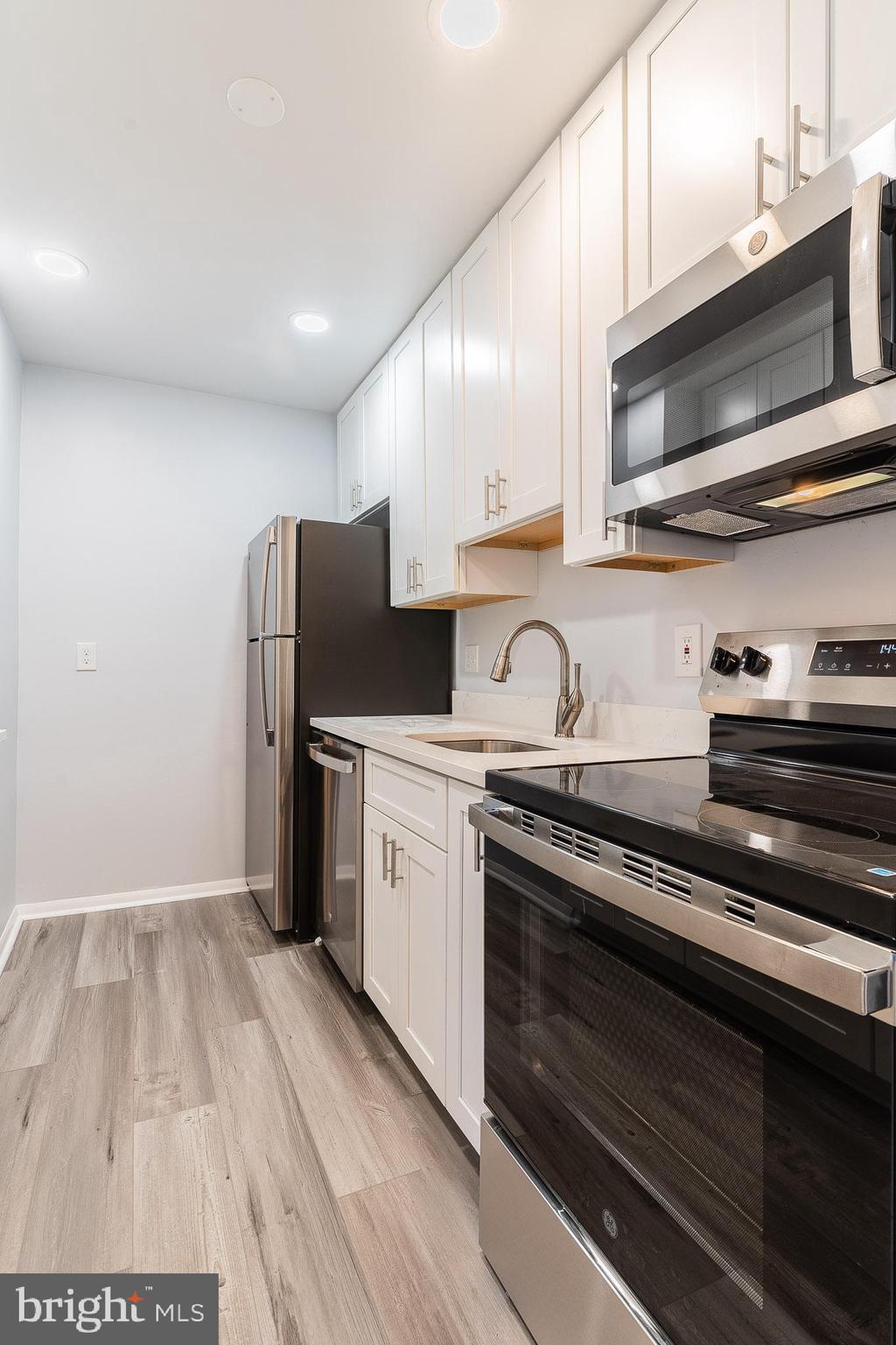 8708 Village Square Drive Alexandria, VA 22309 - Photo 17 of 46 a kitchen with a sink and steel appliances