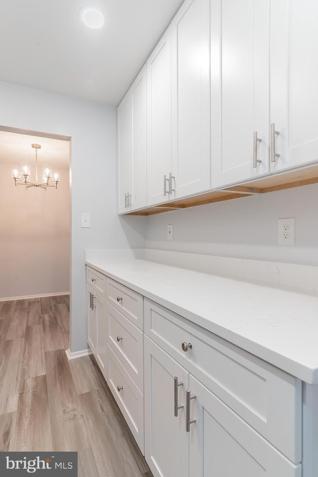8708 Village Square Drive Alexandria, VA 22309 - Photo 21 of 46 a kitchen with white cabinets and white appliances