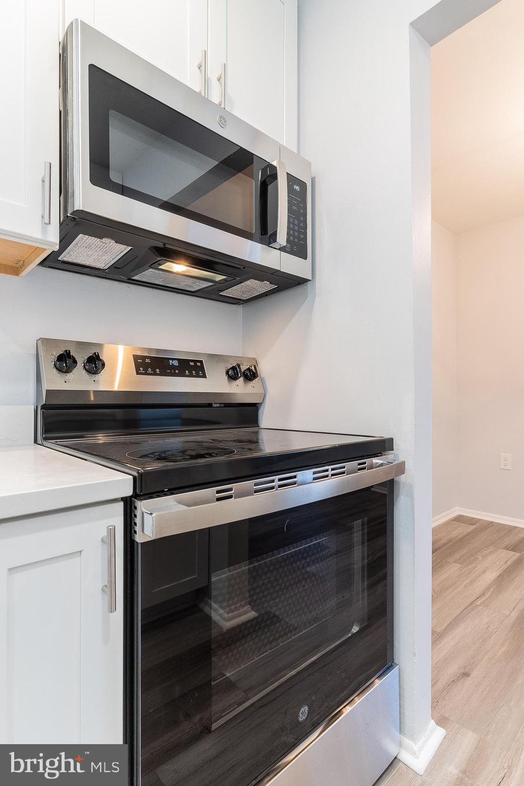 8708 Village Square Drive Alexandria, VA 22309 - Photo 26 of 46 a stove top oven sitting inside of a kitchen