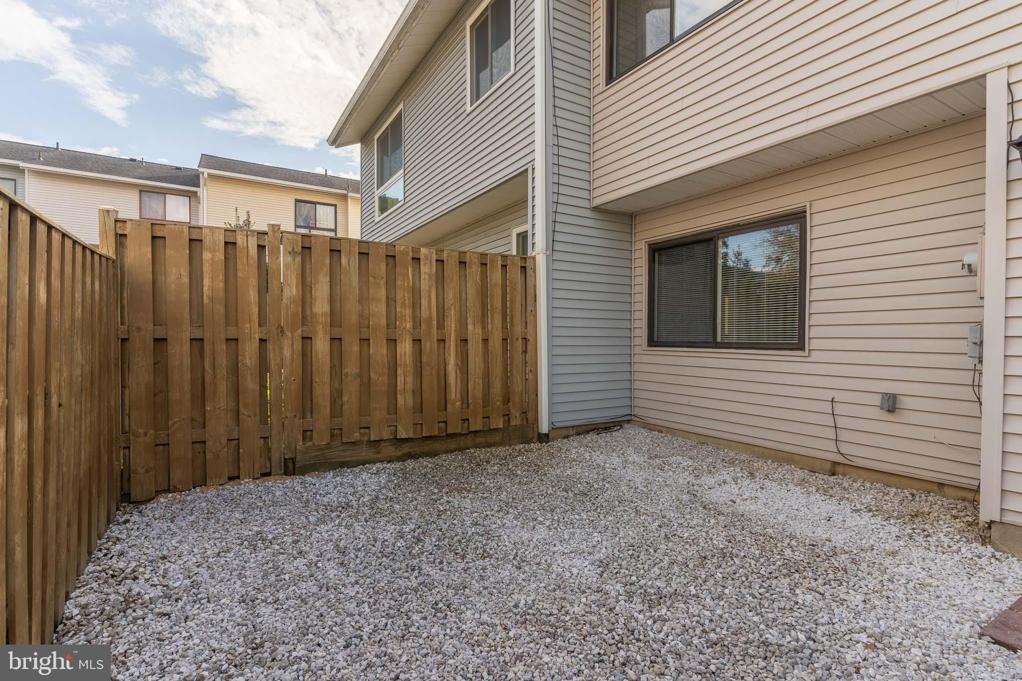 8708 Village Square Drive Alexandria, VA 22309 - Photo 6 of 46 a view of a backyard with wooden fence