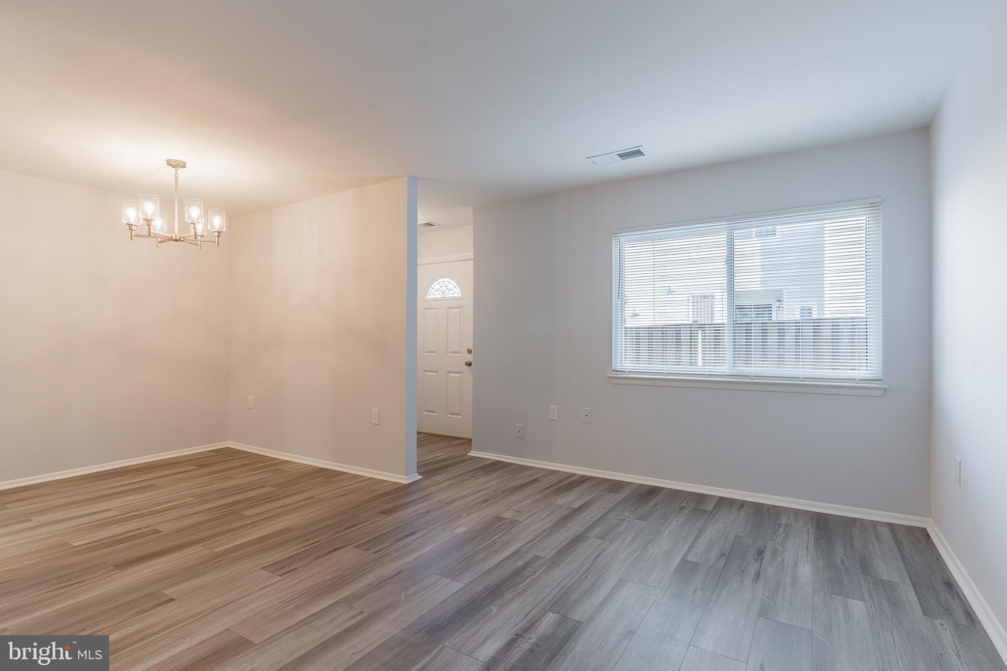 8708 Village Square Drive Alexandria, VA 22309 - Photo 10 of 46 wooden floor in an empty room with a window