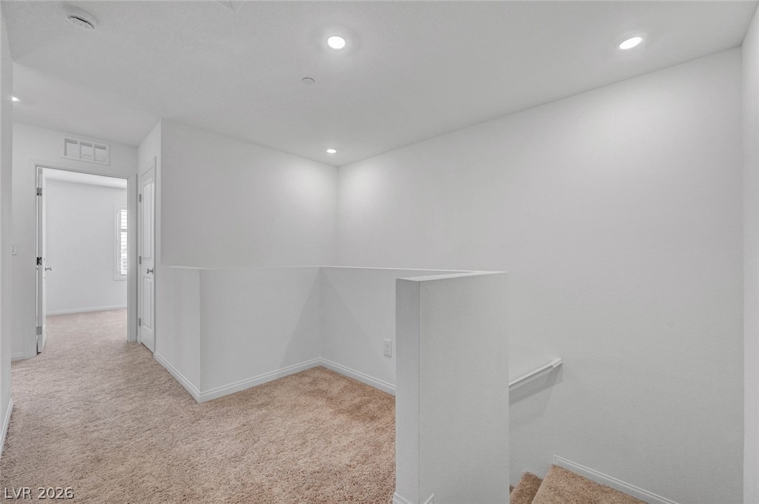 3548 Dimora Street Henderson, NV 89044 - Photo 21 of 40 Corridor featuring baseboards, visible vents, and carpet flooring