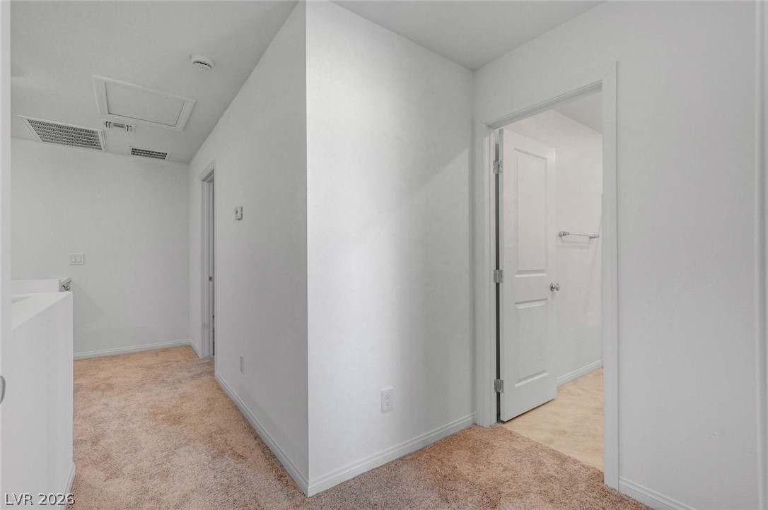3548 Dimora Street Henderson, NV 89044 - Photo 23 of 40 Hall featuring baseboards, visible vents, and light colored carpet