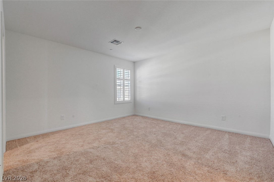 3548 Dimora Street Henderson, NV 89044 - Photo 30 of 40 Empty room with carpet, visible vents, and baseboards