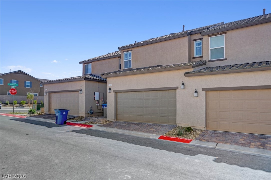 3548 Dimora Street Henderson, NV 89044 - Photo 37 of 40 Multi unit property with a tiled roof and stucco siding