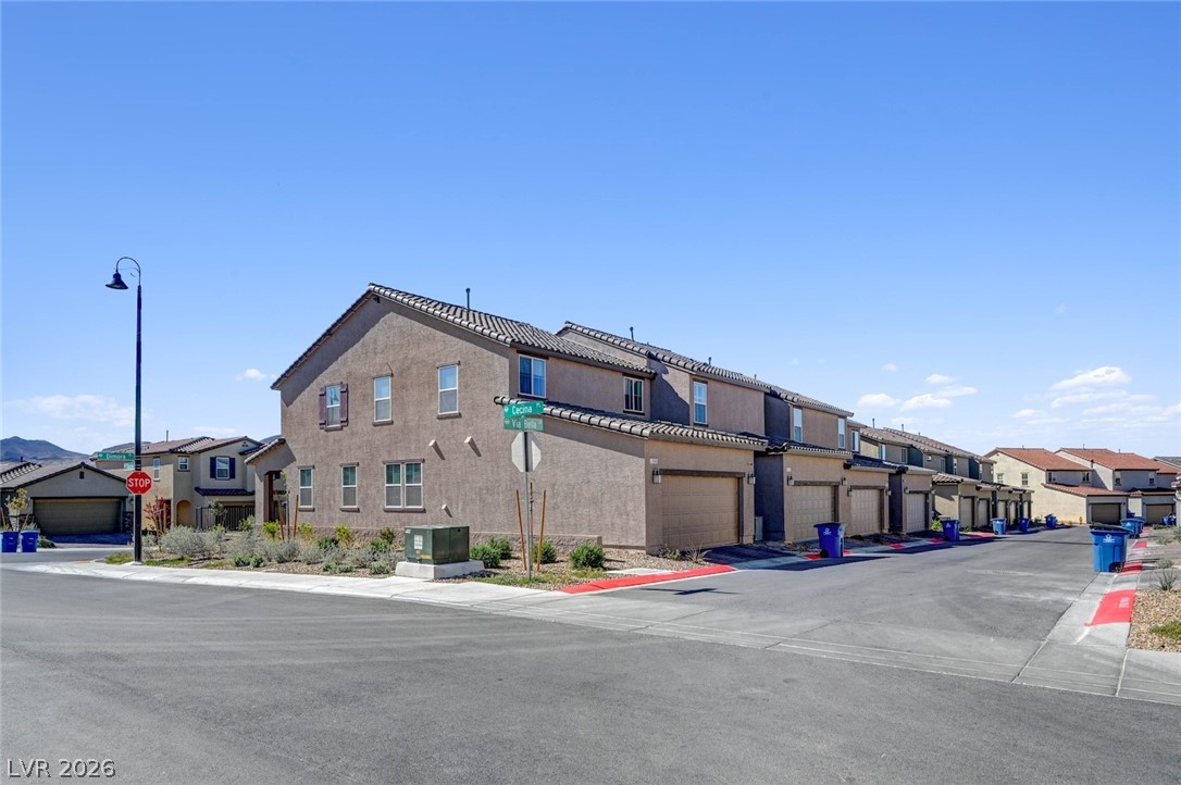 3548 Dimora Street Henderson, NV 89044 - Photo 40 of 40 View of street featuring traffic signs, a residential view, curbs, and sidewalks