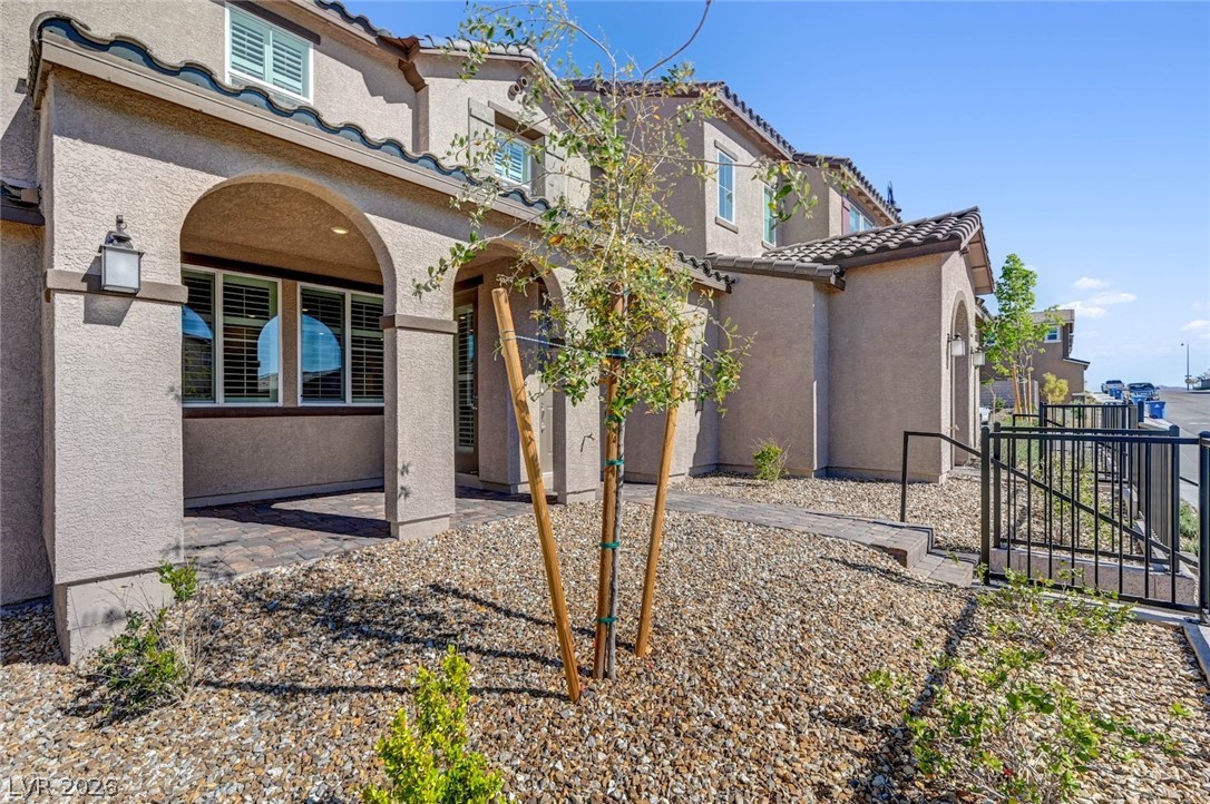 3548 Dimora Street Henderson, NV 89044 - Photo 4 of 40 Back of property with a tile roof, a residential view, and stucco siding