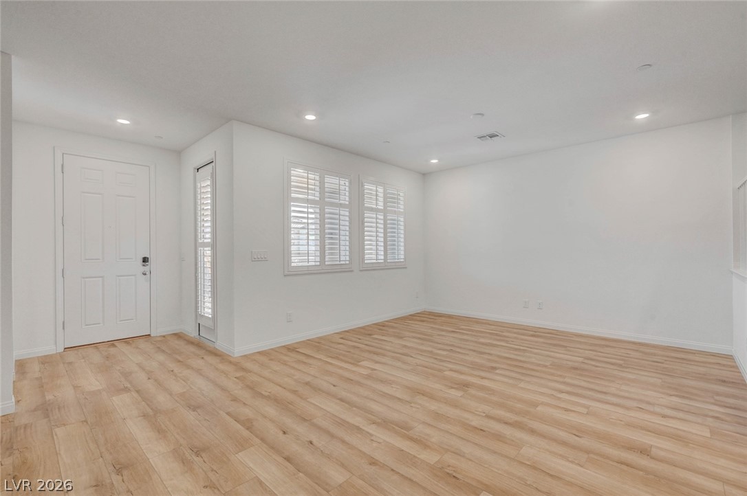 3548 Dimora Street Henderson, NV 89044 - Photo 9 of 40 Empty room featuring recessed lighting, light wood-style floors, visible vents, and baseboards