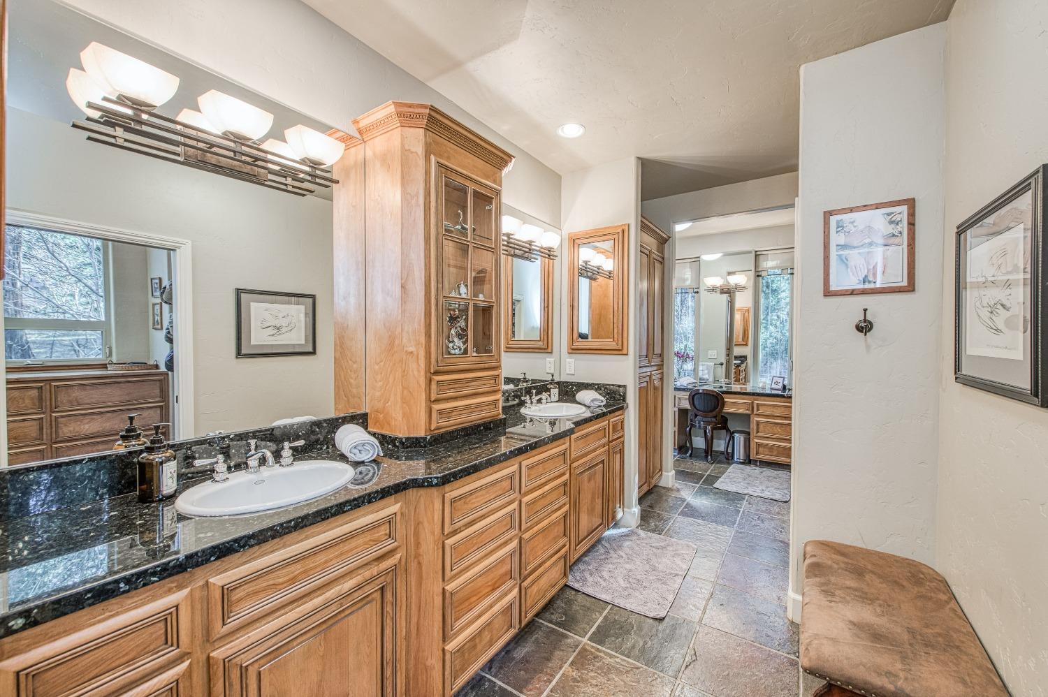 42676 Granite Circle Shaver Lake, CA 93664 - Photo 27 of 99 a spacious bathroom with double vanity and a mirror