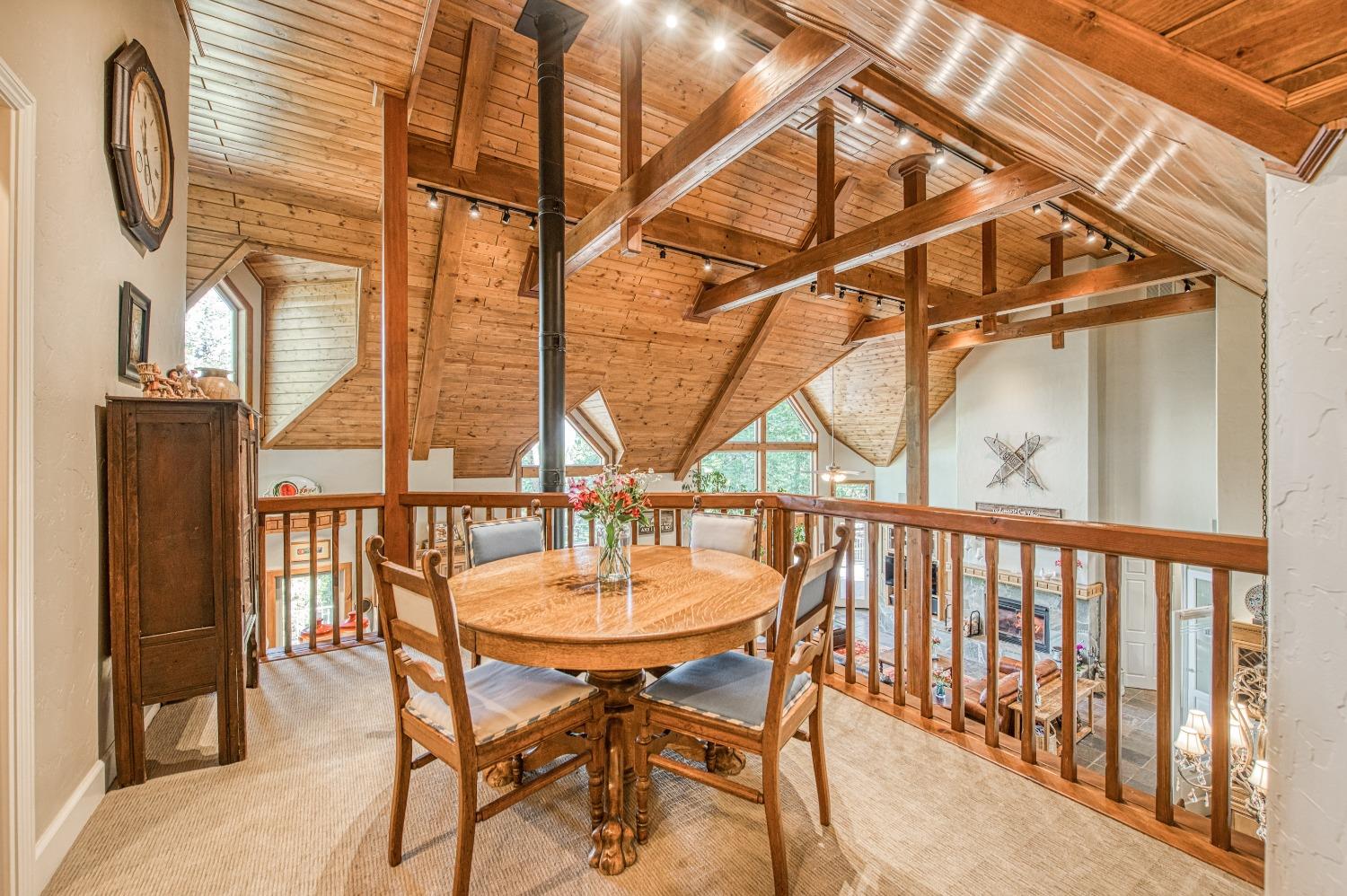 42676 Granite Circle Shaver Lake, CA 93664 - Photo 35 of 99 a dining room with furniture window and wooden floor