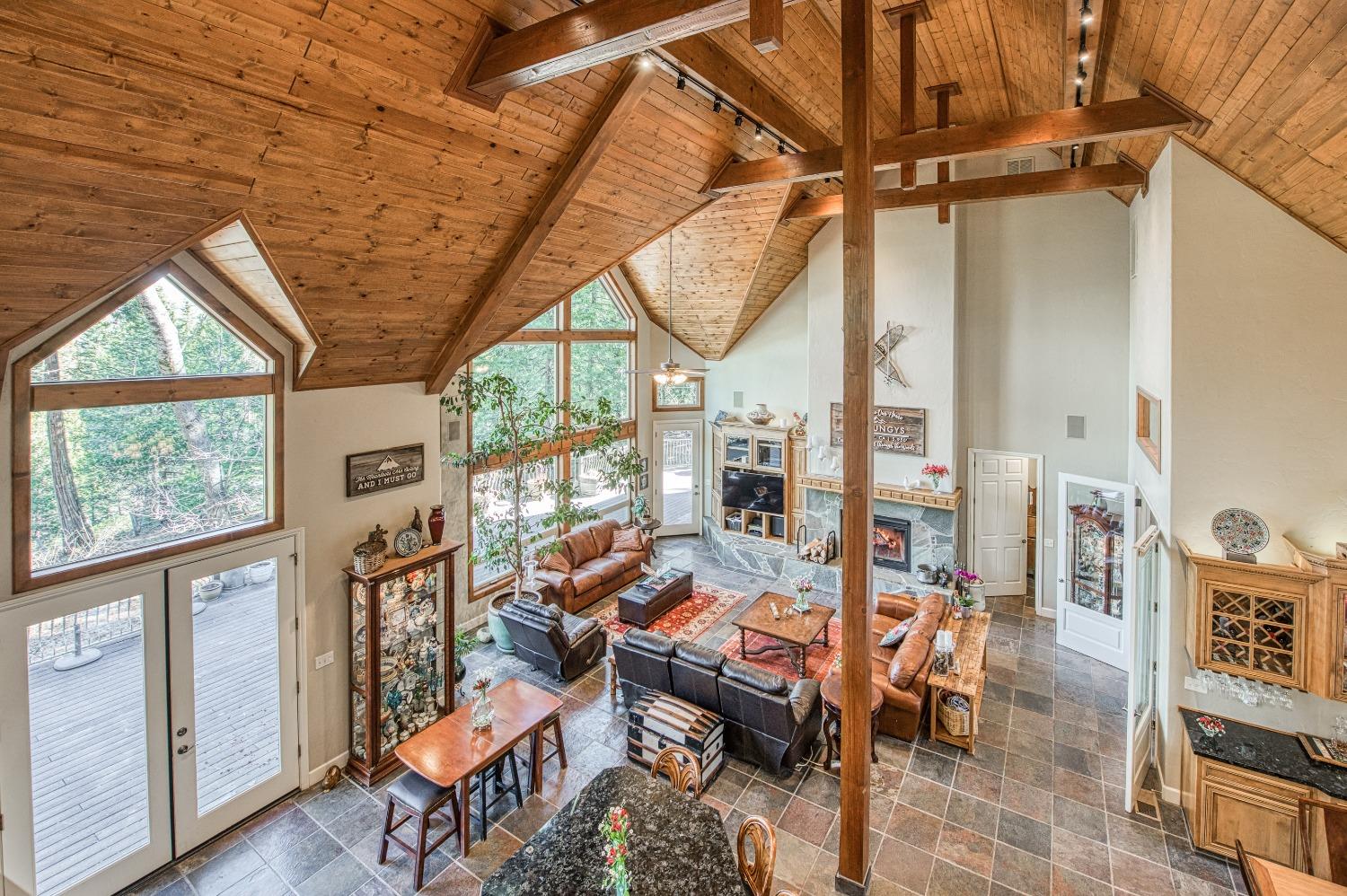 42676 Granite Circle Shaver Lake, CA 93664 - Photo 36 of 99 a living room with furniture a rug and a large window