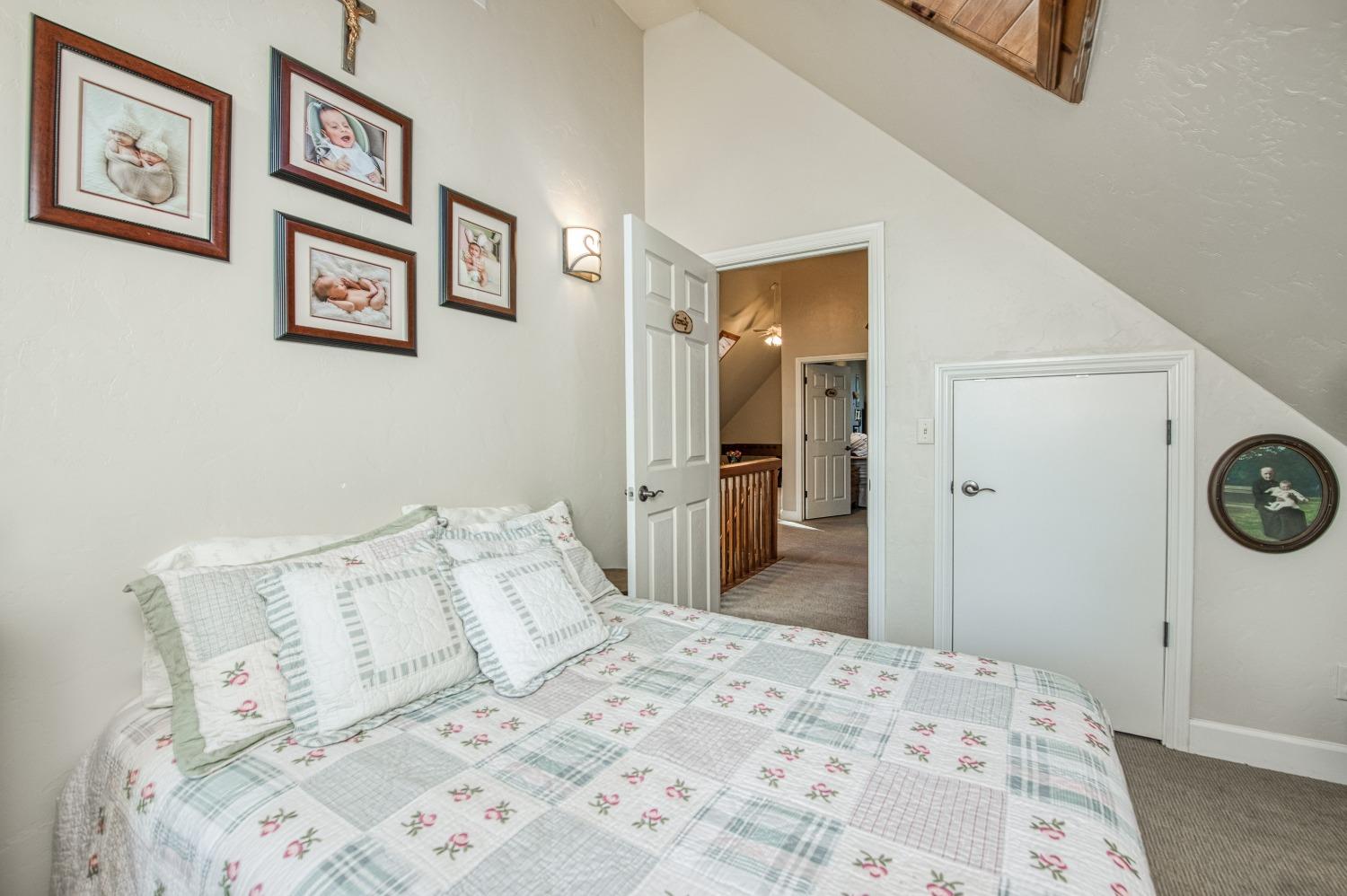 42676 Granite Circle Shaver Lake, CA 93664 - Photo 44 of 99 a bedroom with a bed and painting on the wall