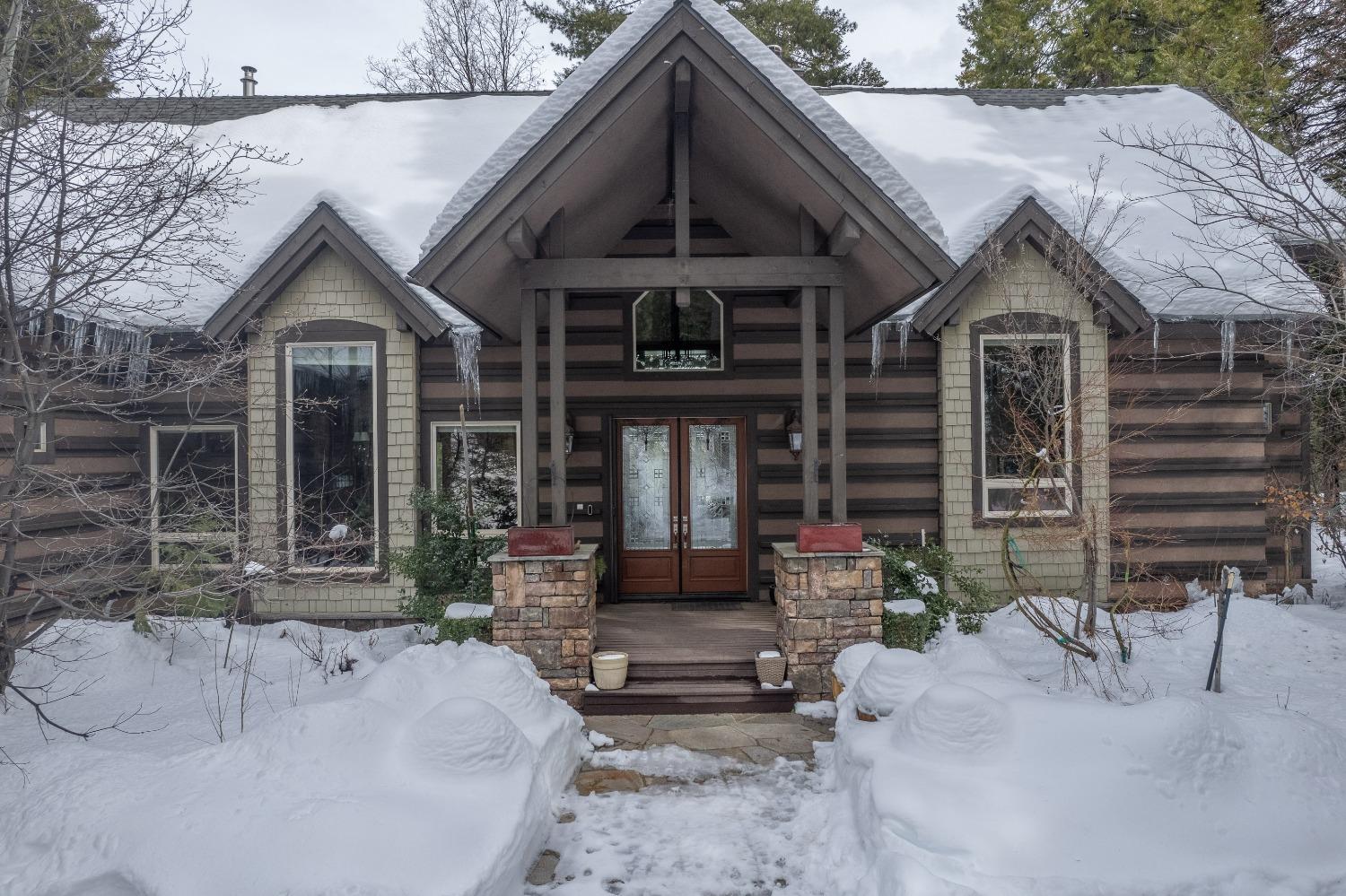 42676 Granite Circle Shaver Lake, CA 93664 - Photo 64 of 99 a front view of a house with garden
