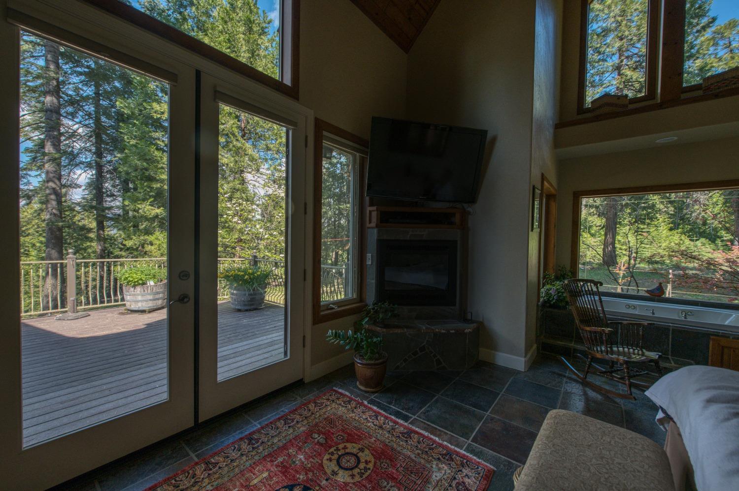42676 Granite Circle Shaver Lake, CA 93664 - Photo 73 of 99 a living room with furniture wooden floor and a fireplace