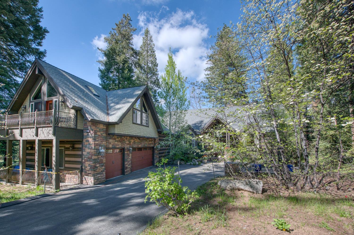 42676 Granite Circle Shaver Lake, CA 93664 - Photo 88 of 99 a front view of a house with a yard and lake view