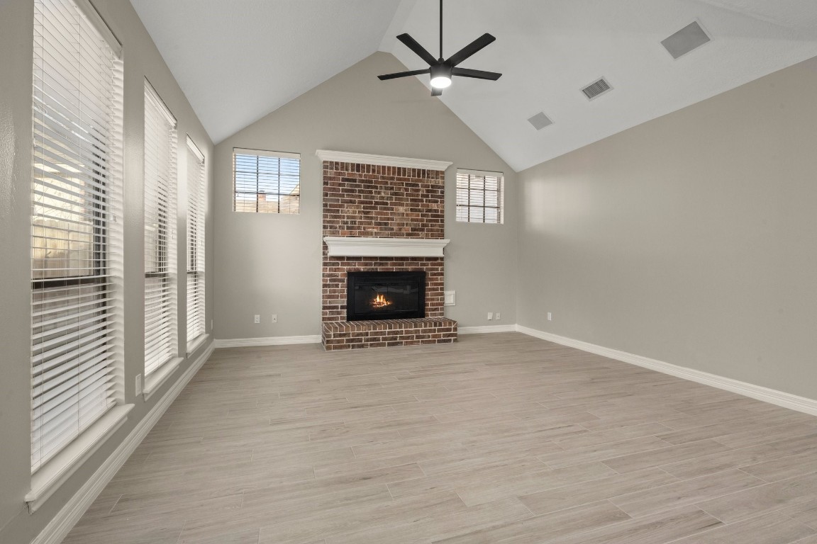 8222 Redchurch Drive Spring, TX 77379 - Photo 15 of 36 a view of an empty room with a fireplace and a window