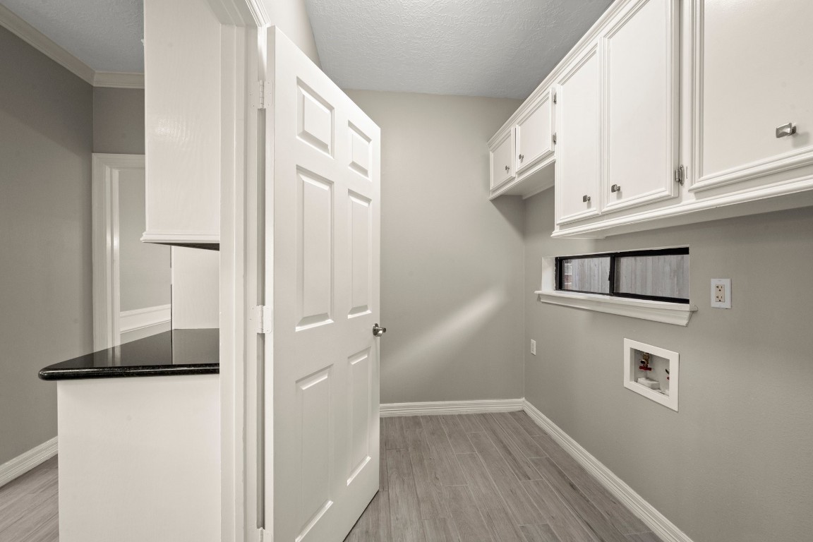 8222 Redchurch Drive Spring, TX 77379 - Photo 23 of 36 a view of a kitchen from the hallway
