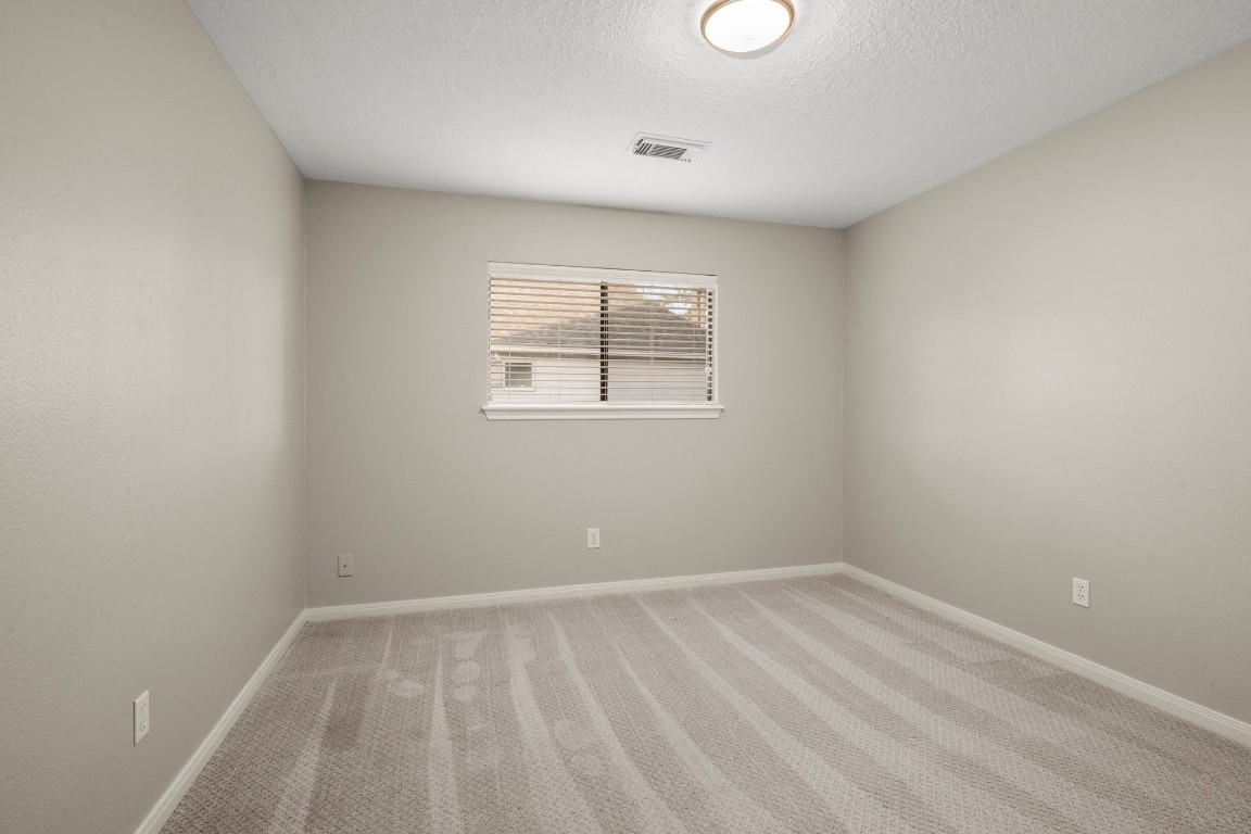 8222 Redchurch Drive Spring, TX 77379 - Photo 25 of 36 an empty room with a window