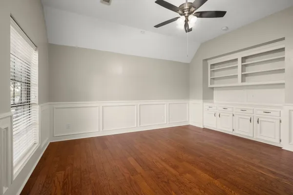 a view of a house with a yard and a garden