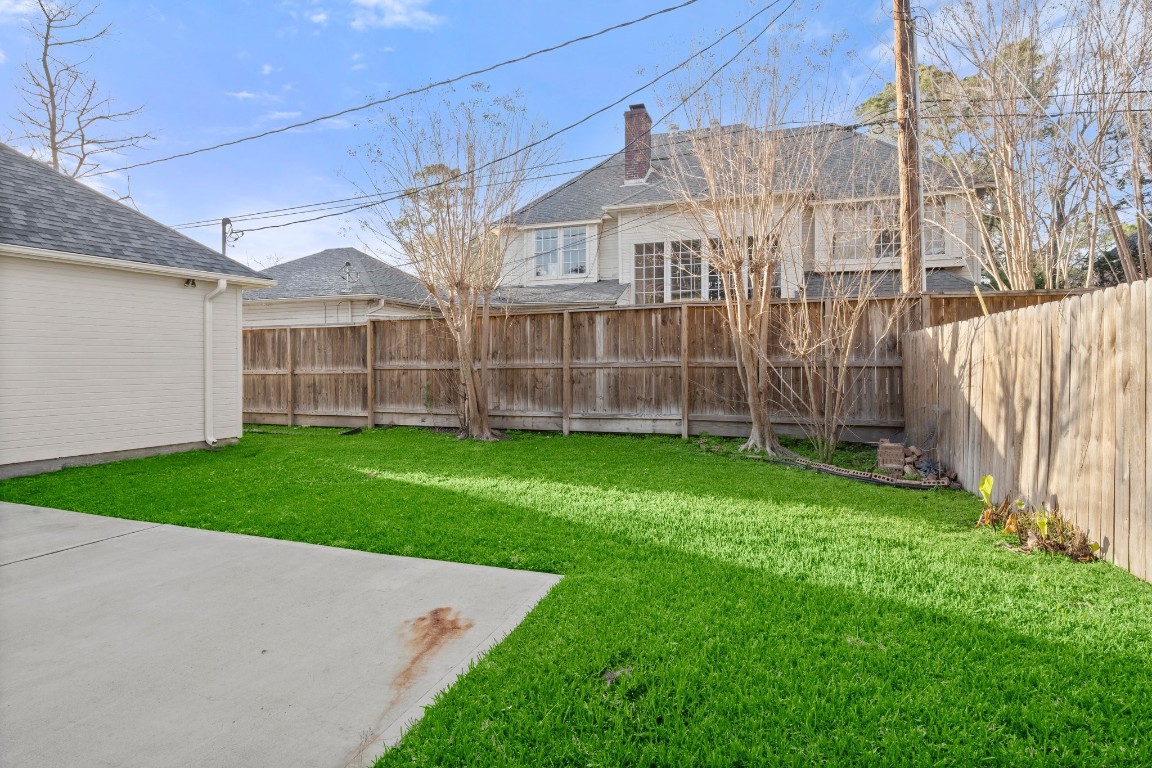 8222 Redchurch Drive Spring, TX 77379 - Photo 35 of 36 a view of a house with a backyard
