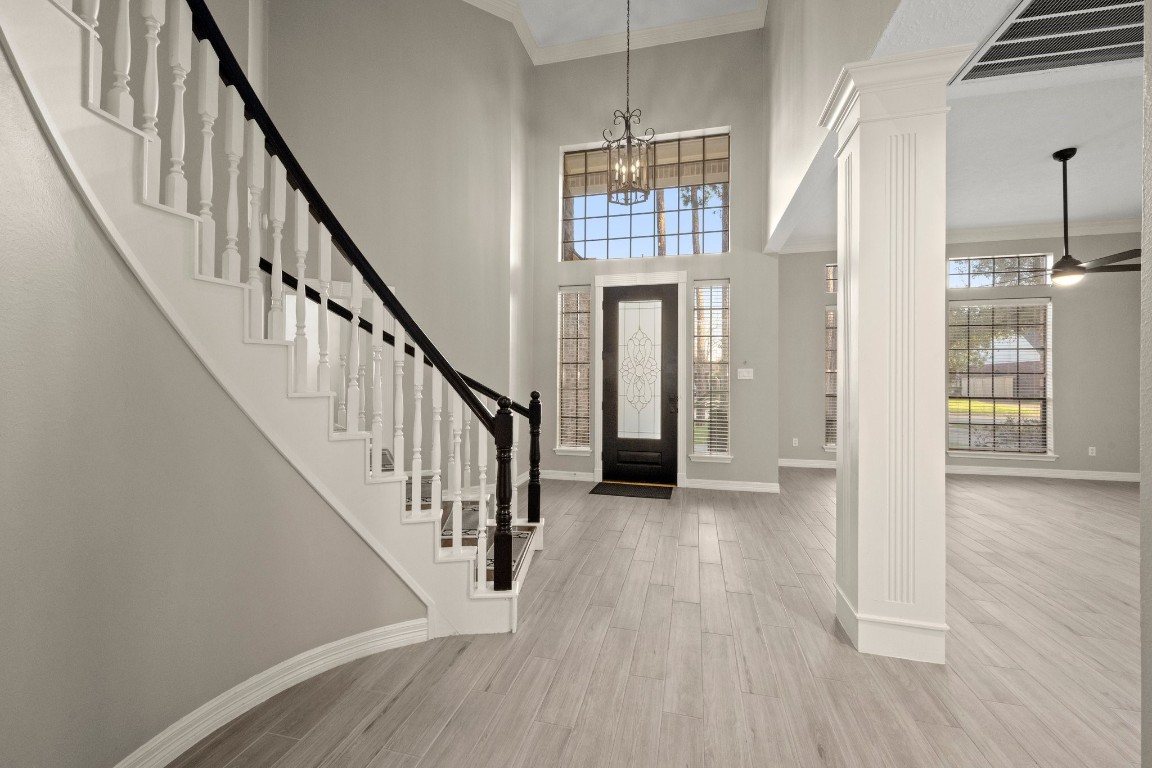 8222 Redchurch Drive Spring, TX 77379 - Photo 6 of 36 a view of staircase with wooden floor and staircase