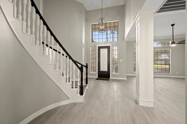 a view of staircase with wooden floor and staircase