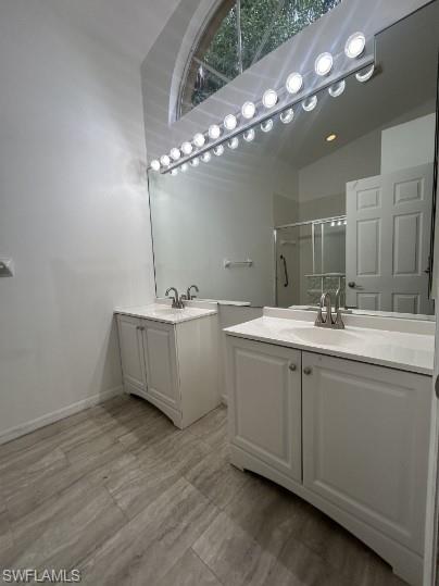 12691 Eagle Pointe Circle Fort Myers, FL 33913 - Photo 11 of 22 Bathroom featuring a sink, a stall shower, and two vanities
