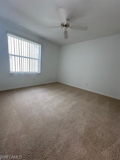 12691 Eagle Pointe Circle Fort Myers, FL 33913 - Photo 13 of 22 Unfurnished room with baseboards, ceiling fan, and carpet flooring