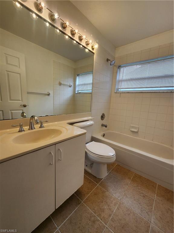 12691 Eagle Pointe Circle Fort Myers, FL 33913 - Photo 15 of 22 Bathroom featuring shower / washtub combination, vanity, and light tile patterned floors