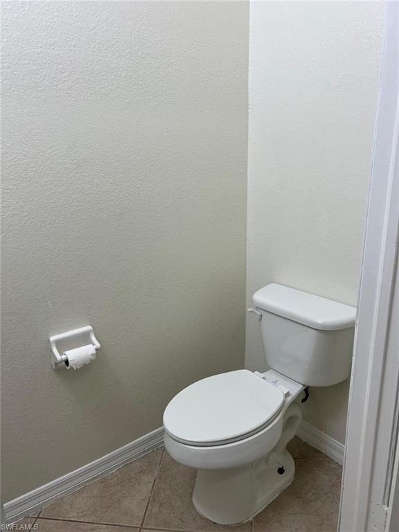 7515 Bristol Circle Naples, FL 34120 - Photo 18 of 42 a white toilet sitting next to a white wall
