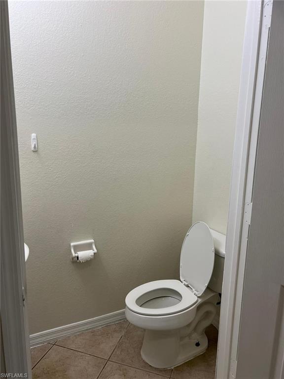 7515 Bristol Circle Naples, FL 34120 - Photo 19 of 42 a white toilet sitting next to a shower