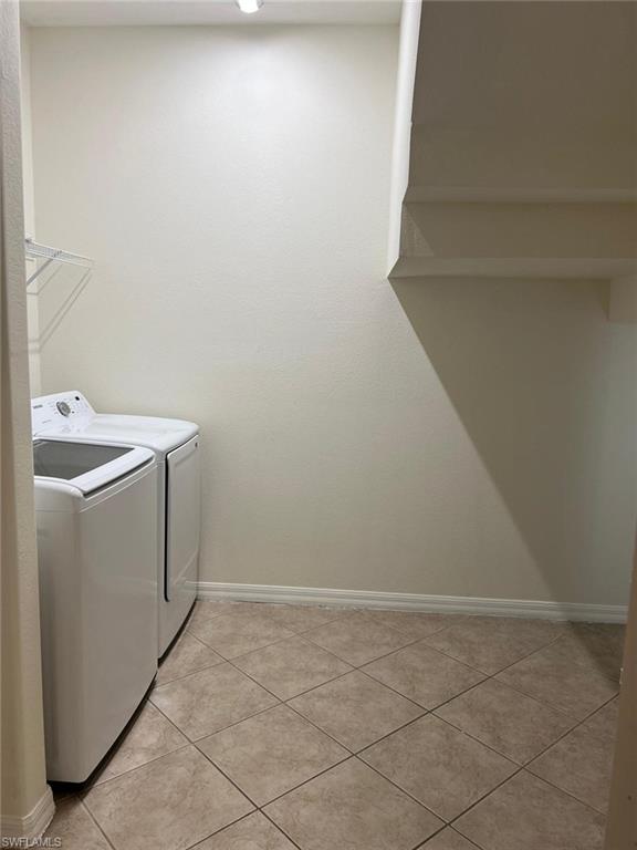 7515 Bristol Circle Naples, FL 34120 - Photo 22 of 42 a utility room with dryer and washer