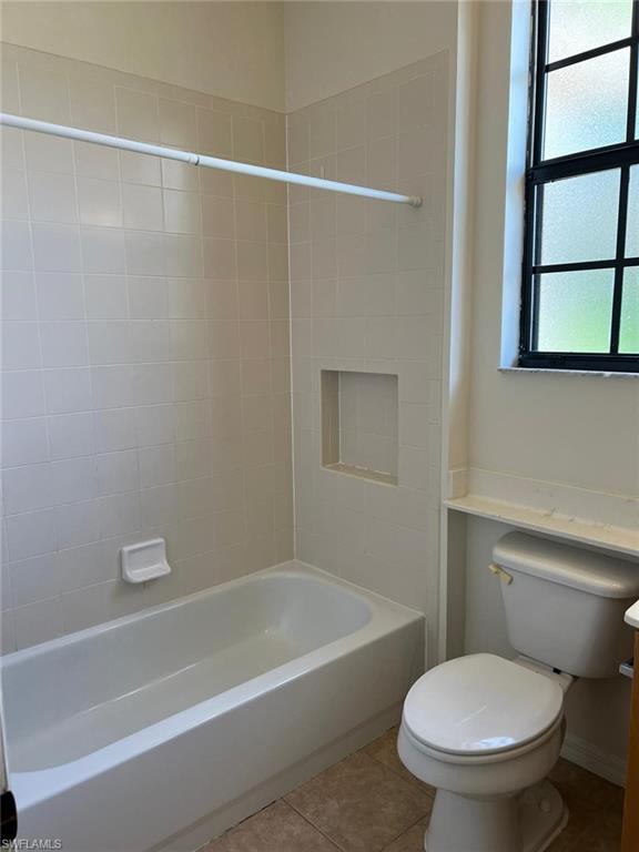 7515 Bristol Circle Naples, FL 34120 - Photo 32 of 42 a bathroom with a toilet and a bathtub