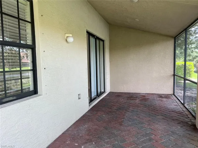 a view of a garden with an outdoor seating space