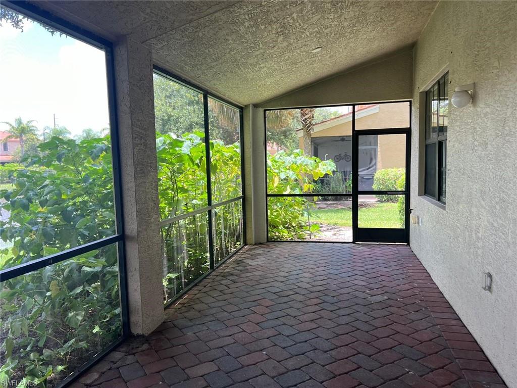 7515 Bristol Circle Naples, FL 34120 - Photo 37 of 42 a view of a garden with an outdoor seating space
