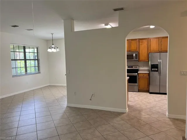 a white refrigerator freezer sitting in a kitchen