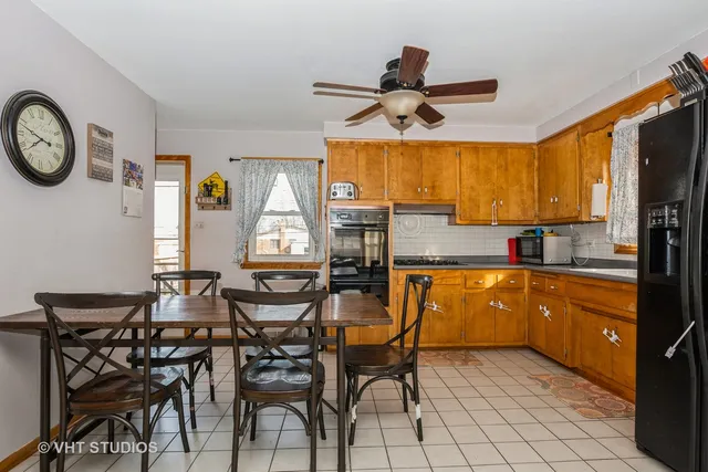 a view of a dining room with furniture and window