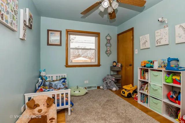 a bedroom with furniture toys and a window