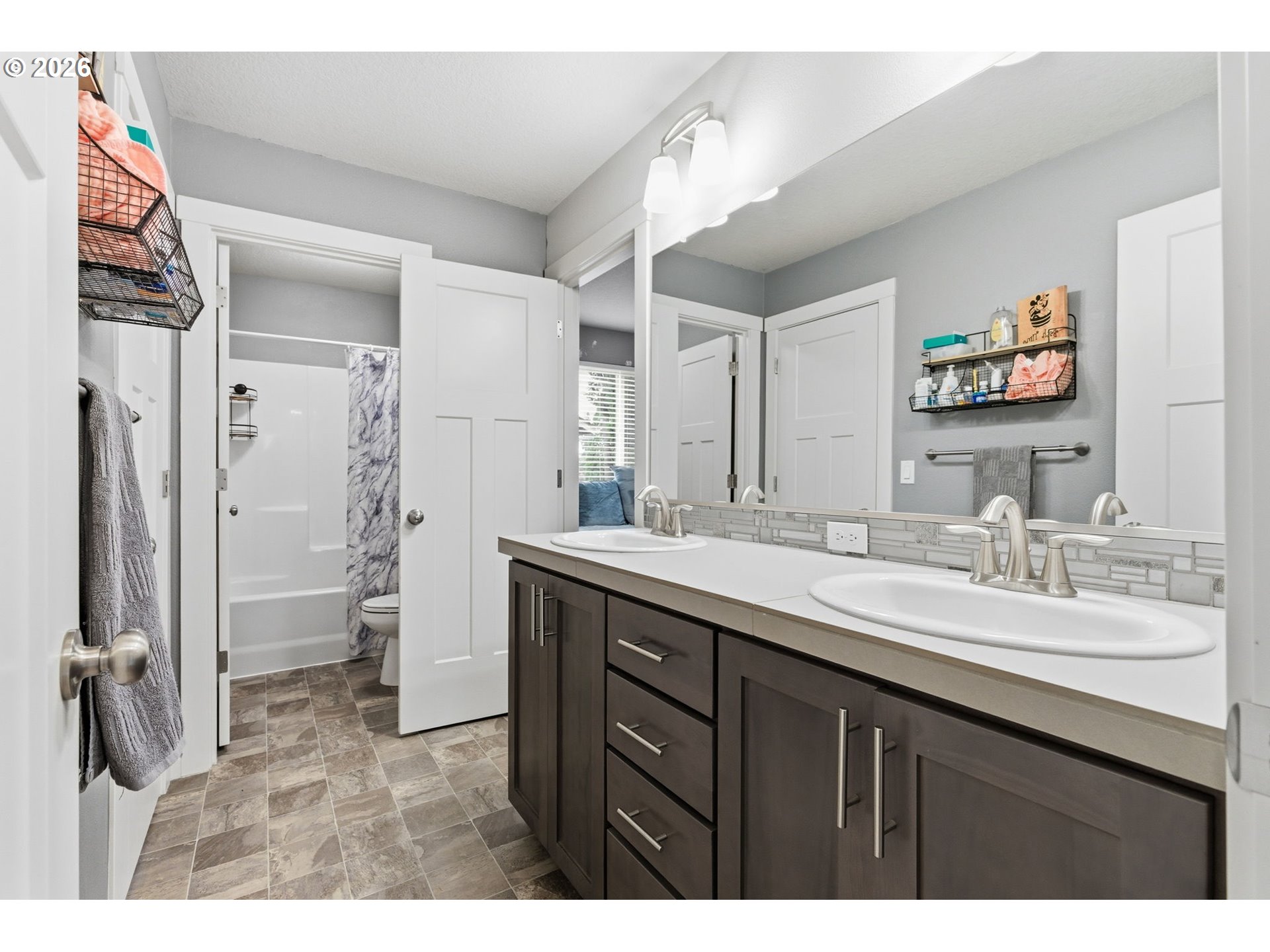 476 Southwest 15th Avenue Canby, OR 97013 - Photo 27 of 41 a bathroom with a sink a toilet and shower