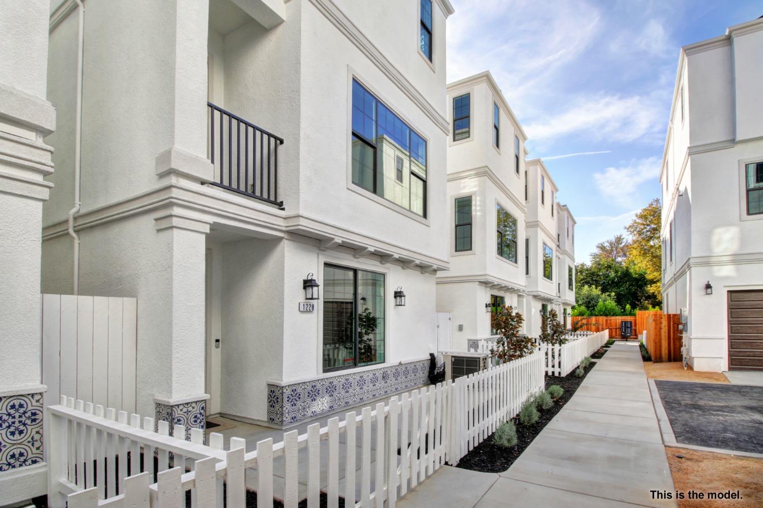 1230 Albright Walk Sacramento, CA 95818 - Photo 1 of 15 a view of a white building among the street