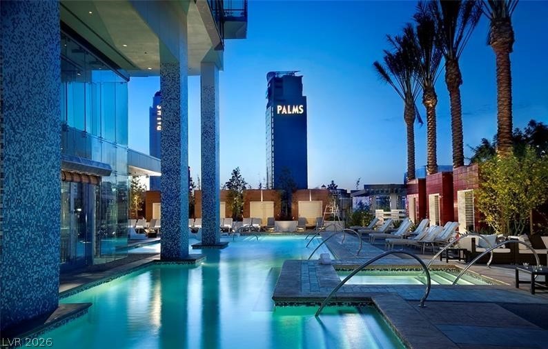 4381 West Flamingo Road, Unit 15310 Las Vegas, NV 89103 - Photo 47 of 52 Community pool with a hot tub and a patio