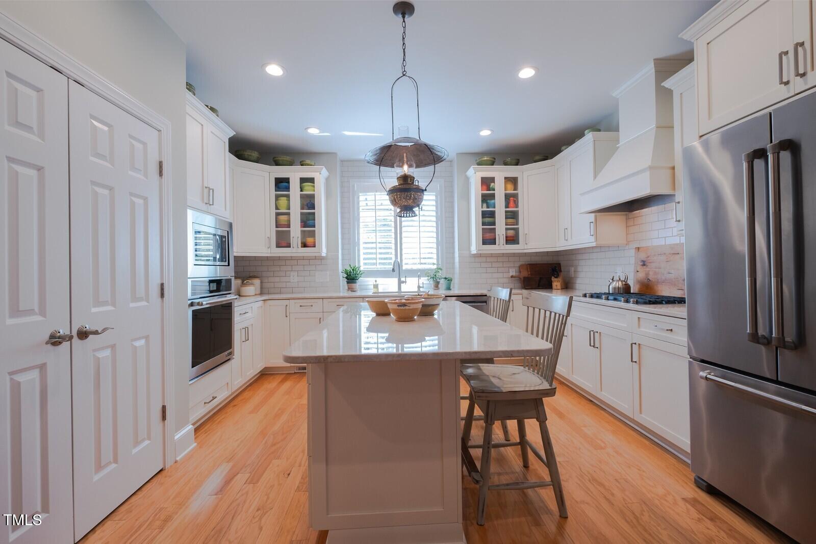 4331 Millcreek Circle Pittsboro, NC 27312 - Photo 14 of 56 a large kitchen with granite countertop lots of counter top space and stainless steel appliances