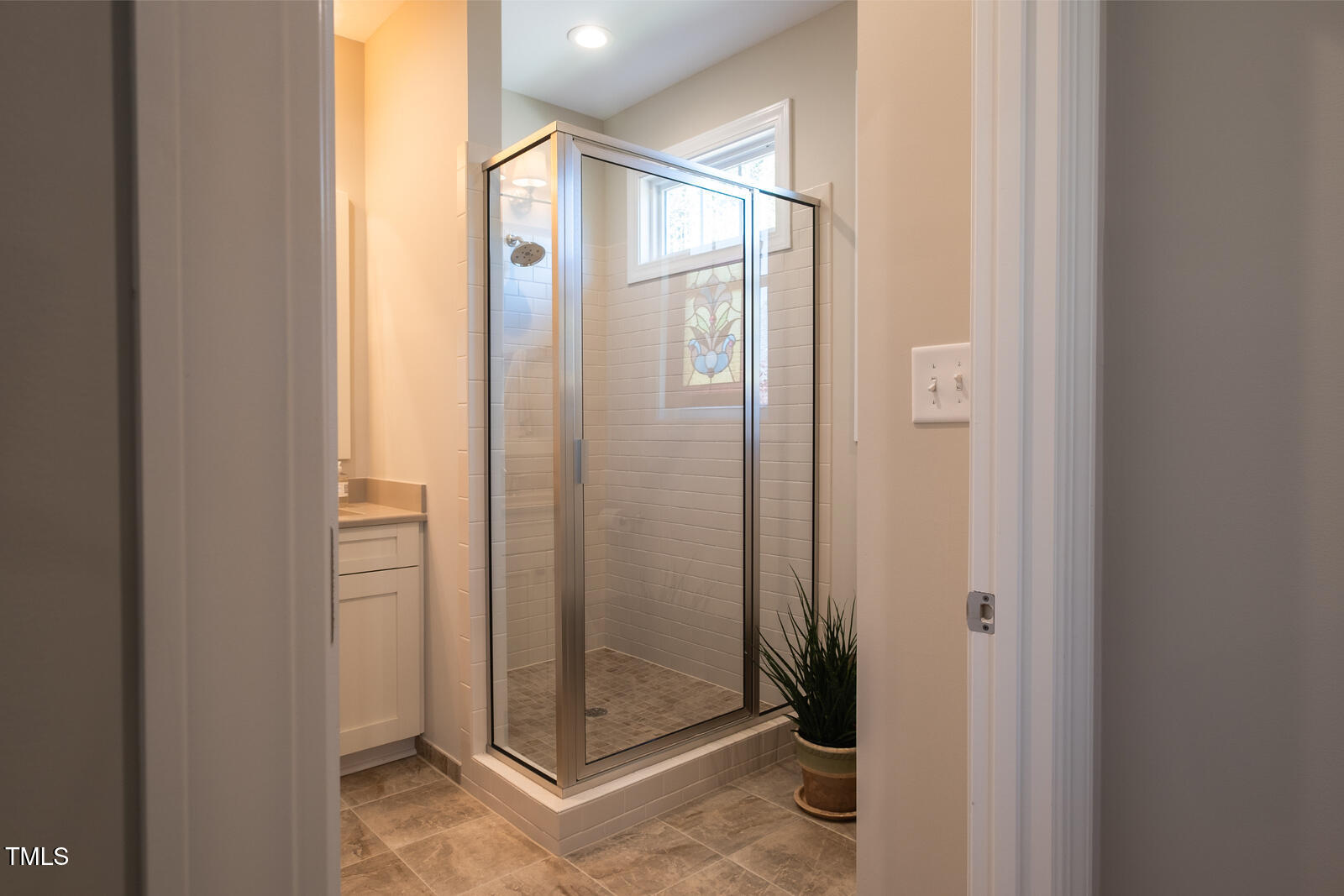 4331 Millcreek Circle Pittsboro, NC 27312 - Photo 19 of 56 a bathroom with a glass shower door