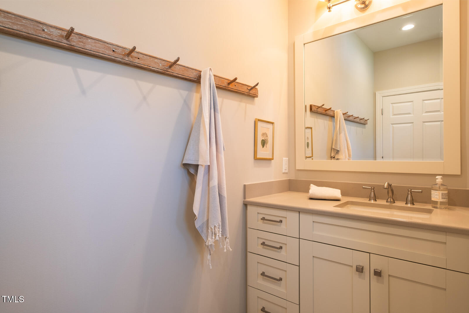 4331 Millcreek Circle Pittsboro, NC 27312 - Photo 21 of 56 a bathroom with a sink and a mirror